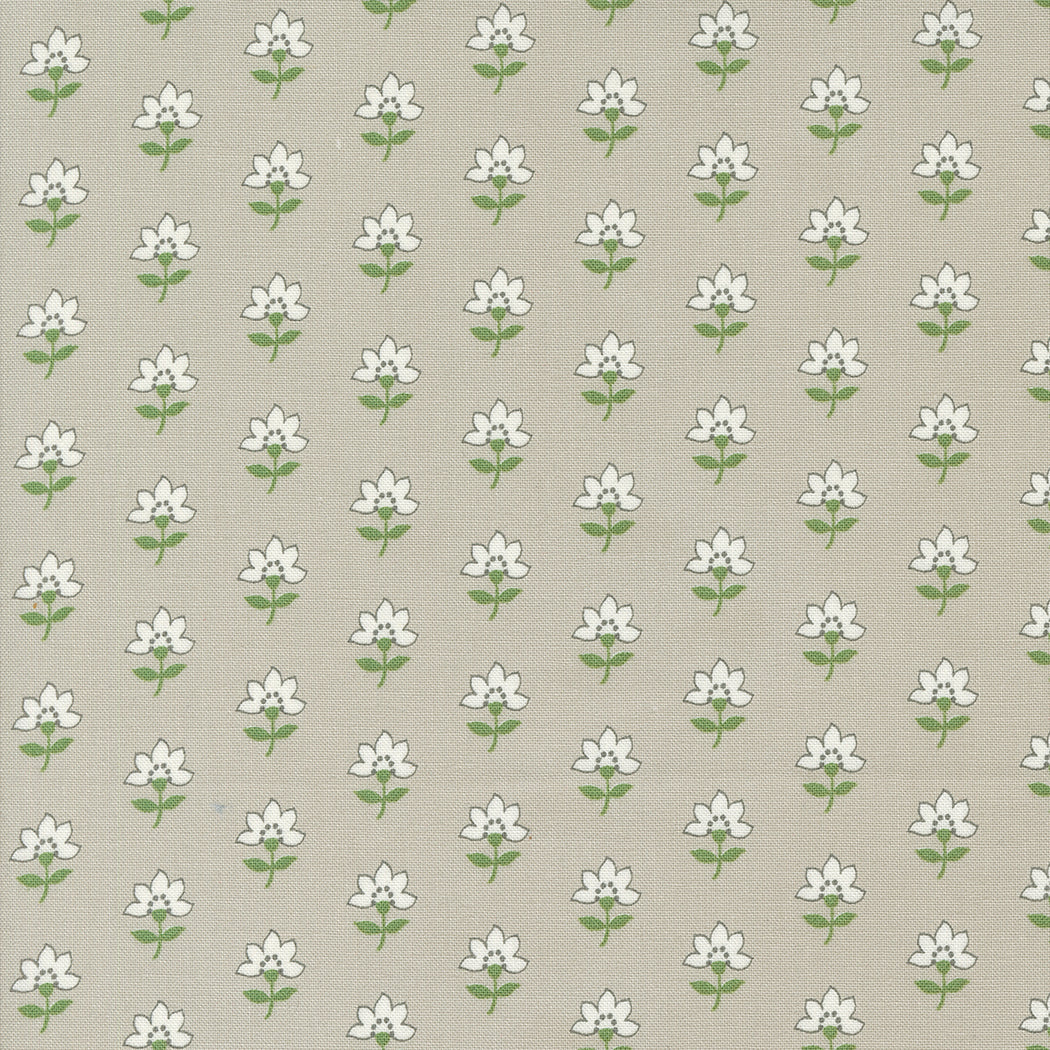 Fabric, Shoreline Camille Roskelley. White floral pattern with light brown background.