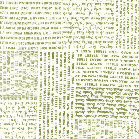 Main Street In The News Text Vanilla Grass M5564113 by Sweetwater for Moda Fabrics (sold in 25cm increments)