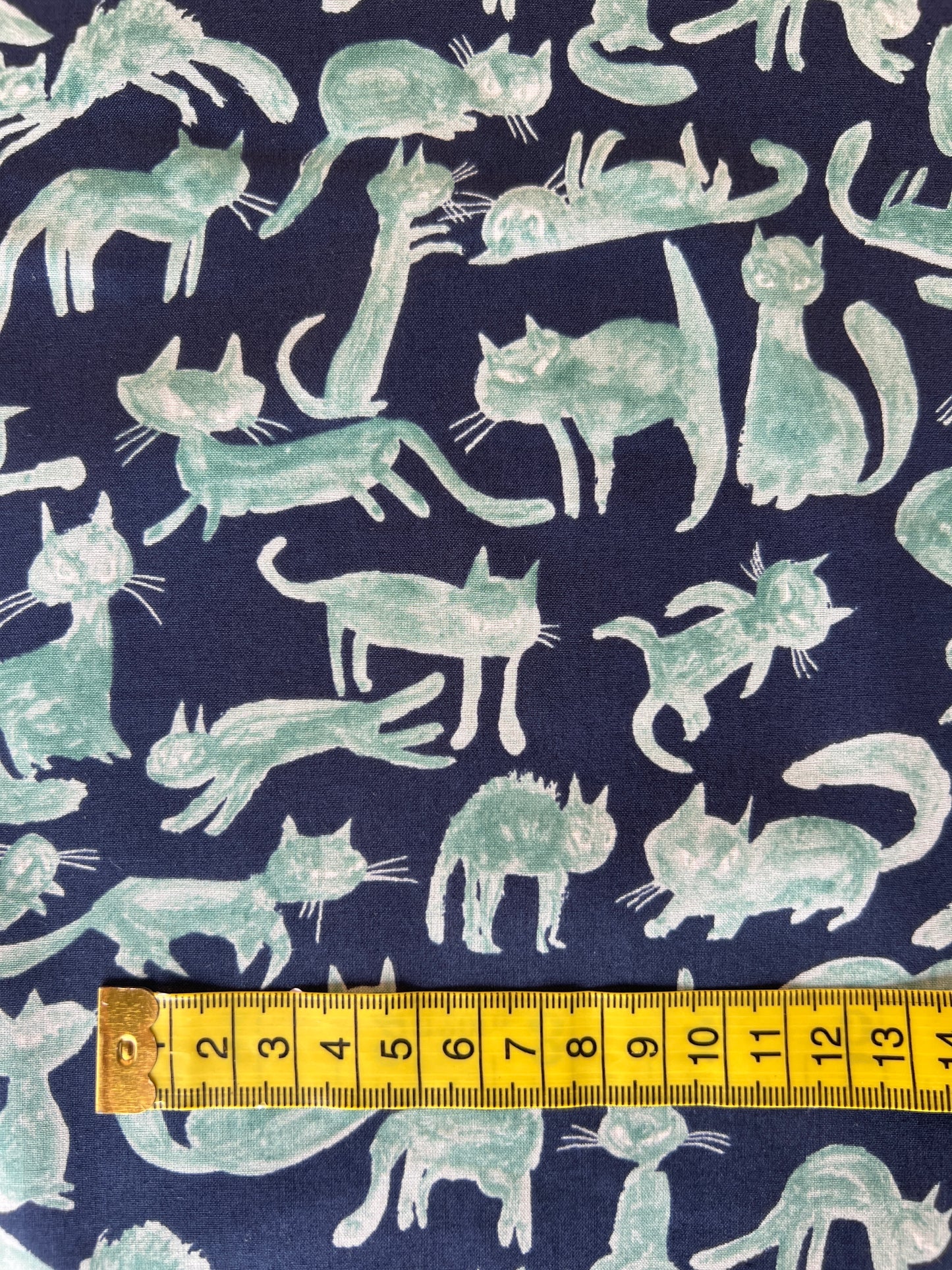 Cats Green on Blue Lawn Fabric by Hokkoh (sold in 25cm increments)